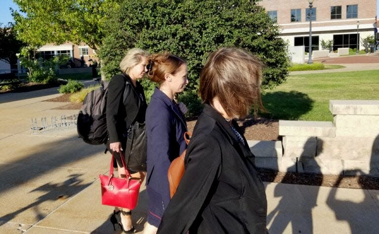 Sheena Greitens, center, leaves the Boone County Courthouse on Wednesday with her attorney, Helen Wade, left, after a 7 1/2-hour deposition hearing in the child custody case stemming from her 2020 divorce from former Gov. Eric Greitens.