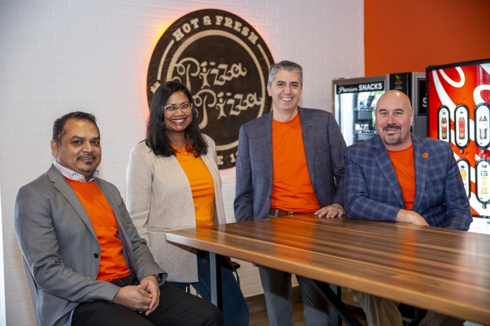  Pizza Pizza executives (from left) Amar Narain, Christine D’sylva, Adrian Fuoco and Chuck Farrell, in a mock restaurant at the company’s head office. NICK KOZAK, POSTMEDIA SUPPLIED
