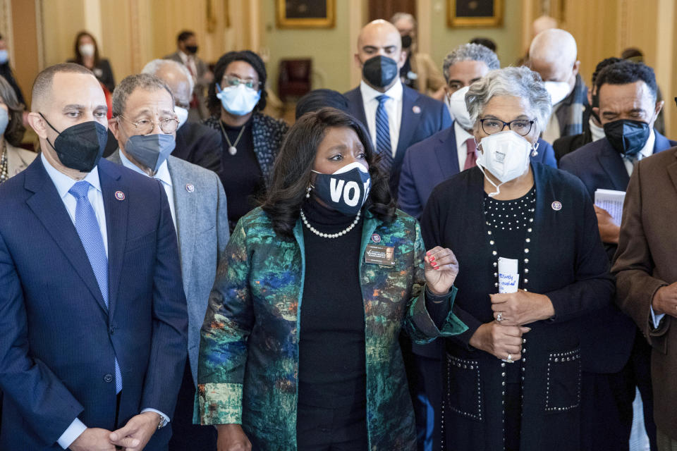 In the front row, from left, Rep. Hakeem Jeffries, D-N.Y., Rep. Terri Sewell and D-Ala., Rep. Joyce Beatty, D-Ohio, alongside other members of the Congressional Black Caucus, speak near the Senate chamber about their support of voting rights legislation at the Capitol in Washington, Wednesday, Jan. 19, 2022. (AP Photo/Amanda Andrade-Rhoades)