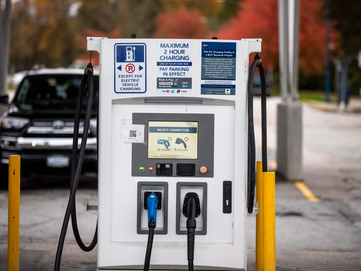 An electric vehicle charging station in Burnaby, B.C. General Motors is pushing into electric vehicles in a big way, installing 40,000 charging stations across North America, including 4,000 in Canada. (Ben Nelms/CBC - image credit)