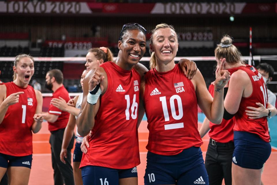 Jordan Larson (10), Foluke Akinradewo and USA women's volleyball finally captured an elusive Olympic gold medal. (Photo by YURI CORTEZ/AFP via Getty Images)