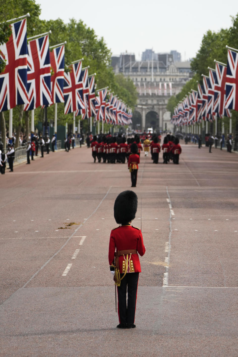 Troops marching down the Mall to Horse Guards parade to take part in the Trooping the Colour parade at Buckingham Palace, in London, Saturday, June 17, 2023. Trooping the Colour is the King's Birthday Parade and one of the nation's most impressive and iconic annual events attended by almost every member of the Royal Family.(AP Photo/Alastair Grant)