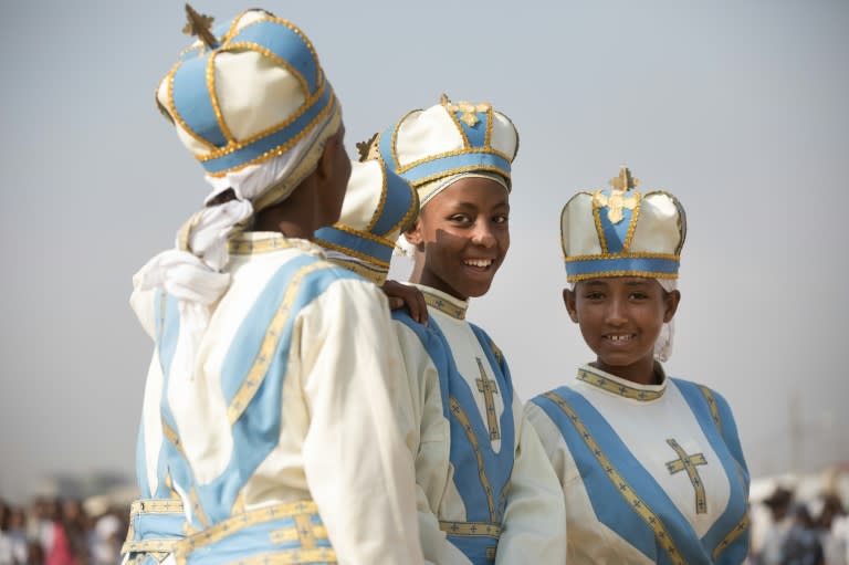 Young girls, dressed in clerical robes, took part in the commemoration