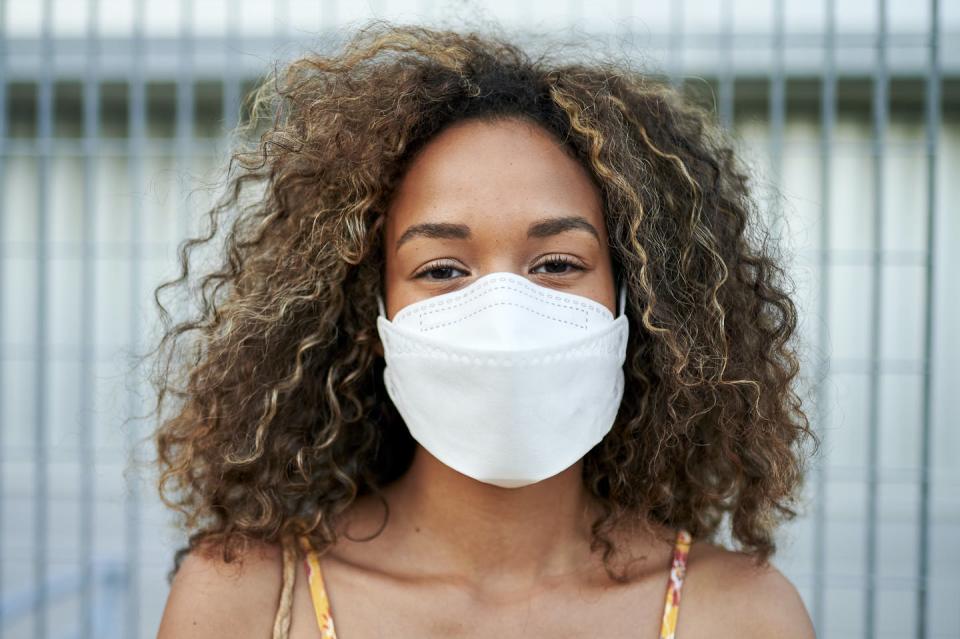 <span class="caption">Masks work for cutting transmission of the coronavirus.</span> <span class="attribution"><a class="link " href="https://www.gettyimages.com/detail/photo/portrait-of-young-woman-with-antiviral-mask-royalty-free-image/1244116600?adppopup=true" rel="nofollow noopener" target="_blank" data-ylk="slk:F.J. Jimenez/Moment via Getty Images;elm:context_link;itc:0;sec:content-canvas">F.J. Jimenez/Moment via Getty Images</a></span>