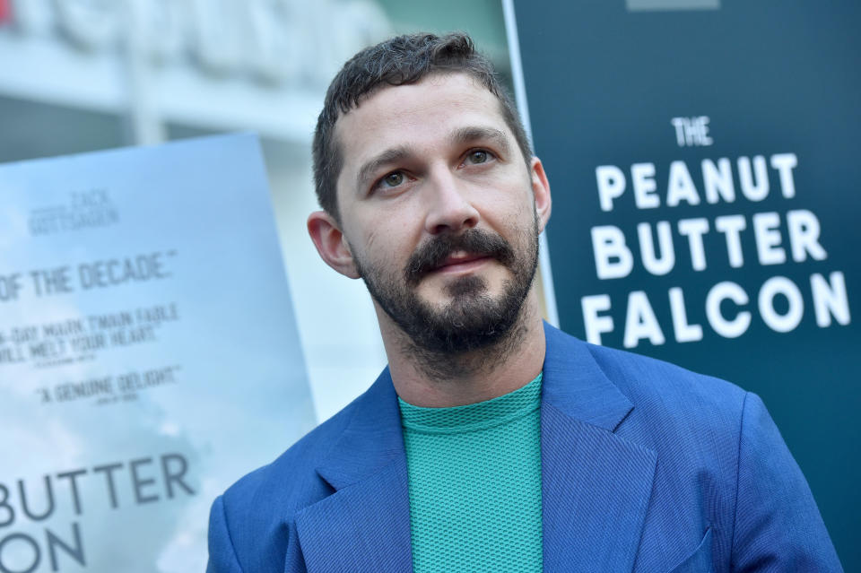 Shia LaBeouf in a blue suit without a tie at "The Peanut Butter Falcon" premiere