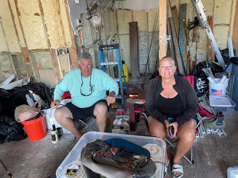 Jim Bryan and Christine Heffern mind Whitney's Bait and Tackle shop on Sanibel March 5.