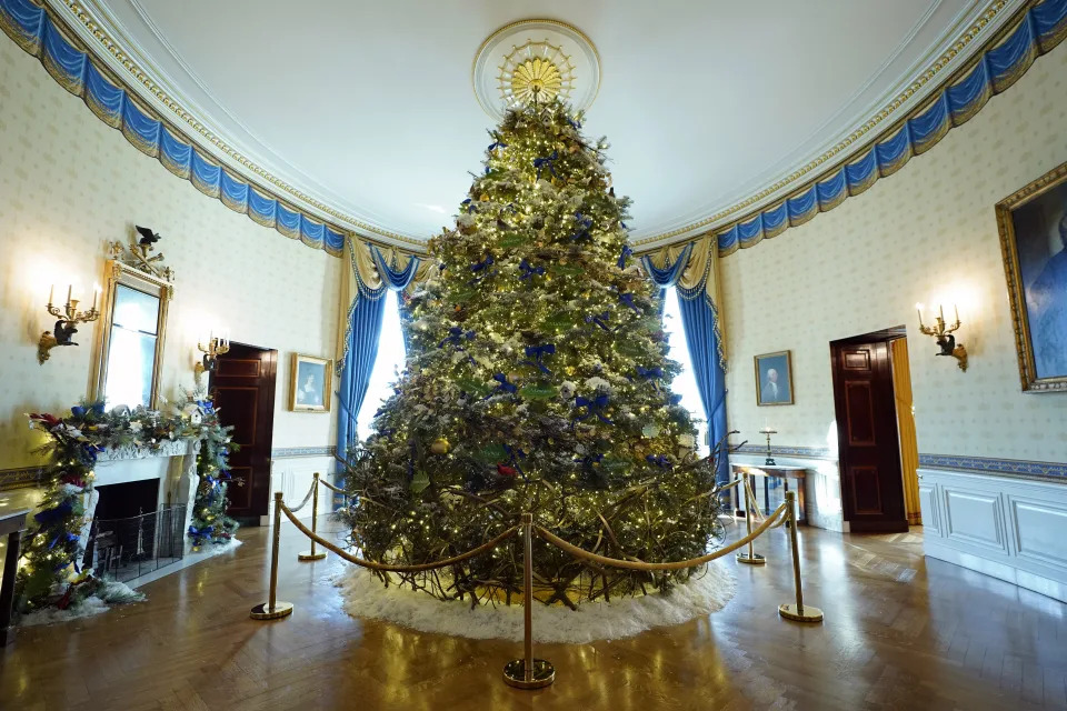 The White House Christmas Tree is on display in the Blue Room of the White House during a press preview of holiday decorations at the White House, Monday, Nov. 28, 2022, in Washington. (AP Photo/Patrick Semansky)