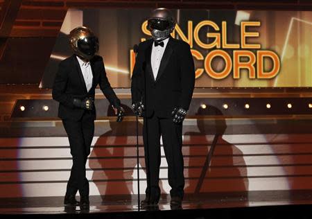 Show hosts Luke Bryan (L) and Blake Shelton, dressed as Daft Punk, address the audience at the 49th Annual Academy of Country Music Awards in Las Vegas, Nevada April 6, 2014. REUTERS/ Robert Galbriath