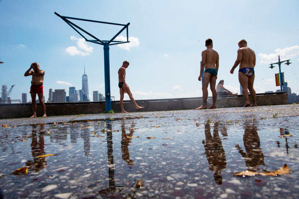 People cool off at Pier 45 on Saturday, July 20, 2019 in New York. Temperatures in the high 90s are forecast for Saturday and Sunday with a heat index well over 100. Much of the nation is also dealing with high heat. (AP Photo/Eduardo Munoz Alvarez)