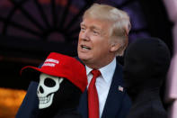 <p>U.S. President Donald Trump and First Lady Melania Trump (not pictured) give out Halloween treats to children at the South Portico of the White House in Washington, D.C. on Oct. 30, 2017. (Photo: Carlos Barria/Reuters) </p>