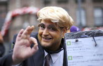 <p>A carnival reveler dressed up as U.S. President Donald Trump celebrates in Duesseldorf, Germany, Feb. 23. 2017. (Photo: Ina Fassbender/AP) </p>