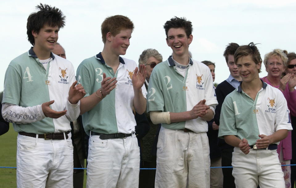 Prince Harry with his teammates from the Eton Polo Society smiling and applauding the opposing team, the Cheltenham College Polo Club.&nbsp;