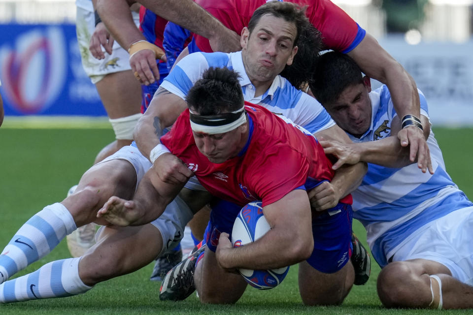 Chile's Raimundo Martinez is tackled by Argentina's Nicolas Sanchez during a Rugby World Cup Pool D match at the Stade de la Beaujoire in Nantes, France, Saturday, Sept. 30, 2023. (AP Photo/Themba Hadebe)