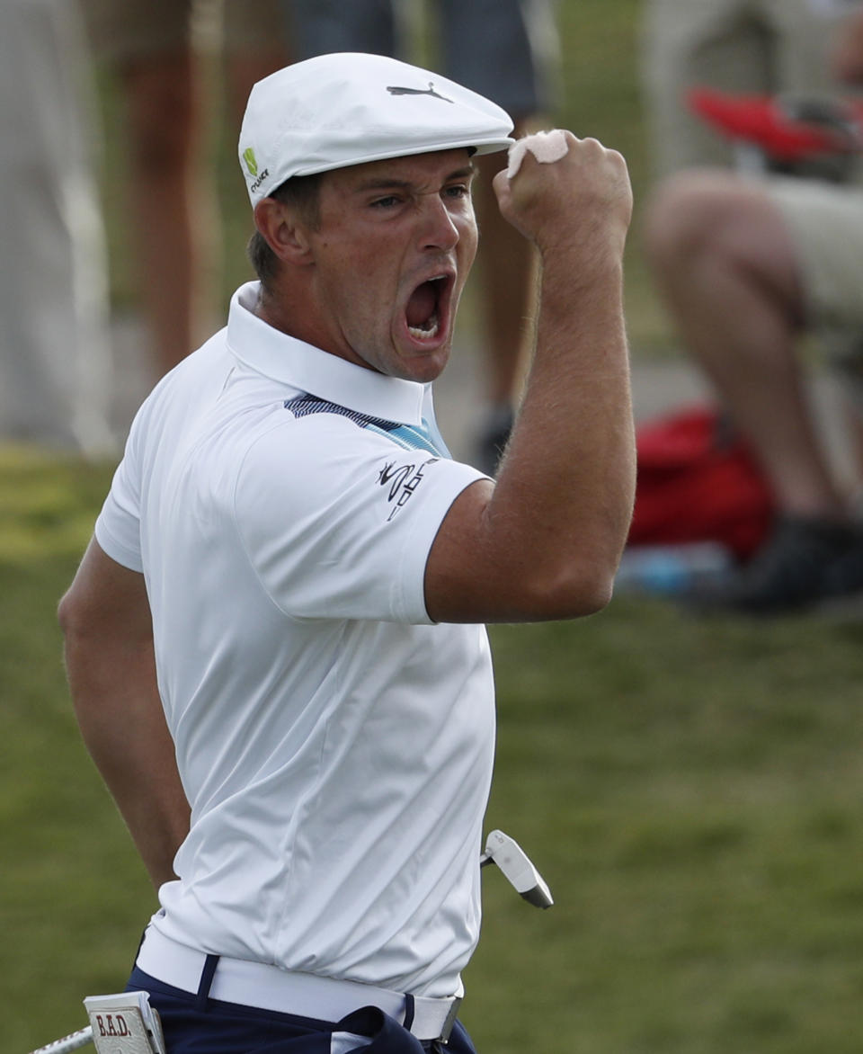 Bryson DeChambeau celebrates after sinking a putt for an eagle on the 16th green during the final round of the Shriners Hospitals for Children Open golf tournament Sunday, Nov. 4, 2018, in Las Vegas. (AP Photo/John Locher)