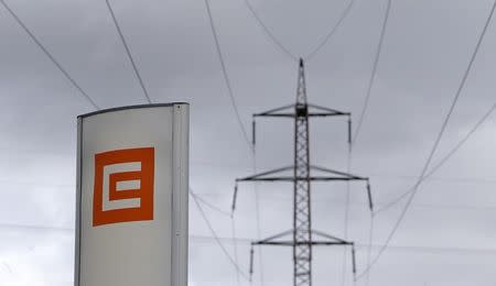 FILE PHOTO: Czech electricity producer CEZ's logo is seen next to an electricity pylon in front of the Ledvice coal-fired power plant near the village of Ledvice, Czech Republic, February 9, 2016. REUTERS/David W Cerny