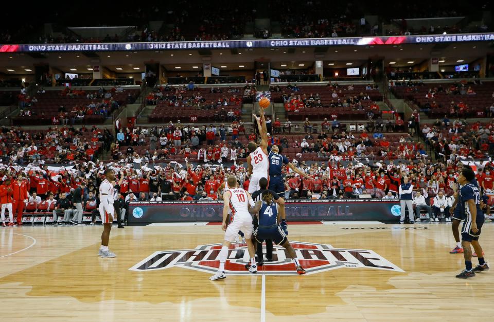 Ohio State Buckeyes forward Zed Key (23) takes the opening tip-off of the 2021-22 season against Akron Zips forward Enrique Freeman (25) during the first half of the NCAA men's basketball game at Value City Arena in Columbus on Tuesday, Nov. 9, 2021.
