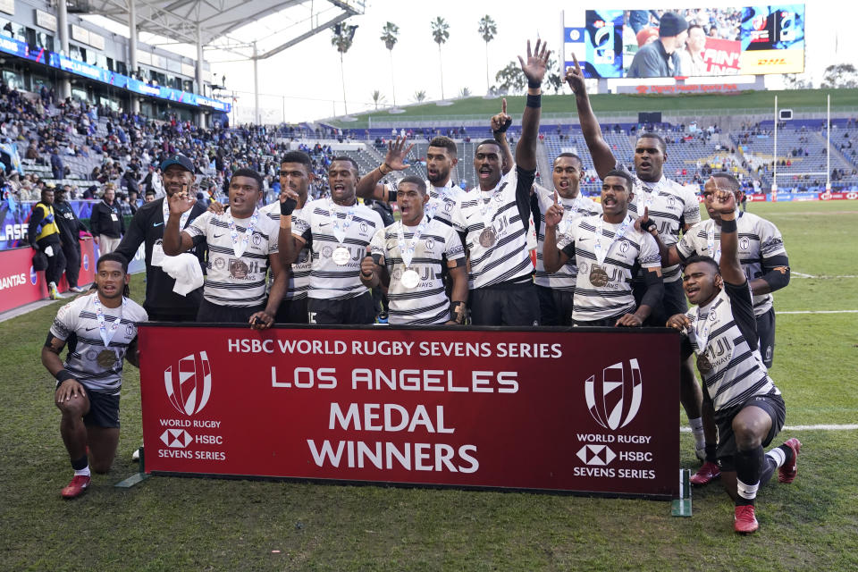Players for Fiji celebrate after winning the bronze medal in the World Rugby Sevens Series Sunday, Feb. 26, 2023, in Carson, Calif. (AP Photo/Marcio Jose Sanchez)