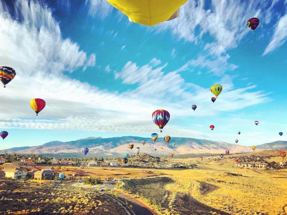 View of the hot air balloons over a vast field in Nevada