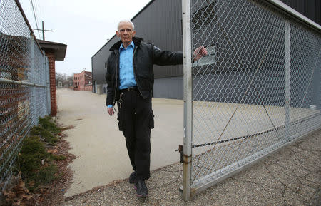 Security guard Jerry Meyer closes the gate to Ross's auto-parts manufacturing plant, which closed its doors in December 2016, in Canton, Ohio, U.S., January 14, 2017. REUTERS/Aaron Josefczyk