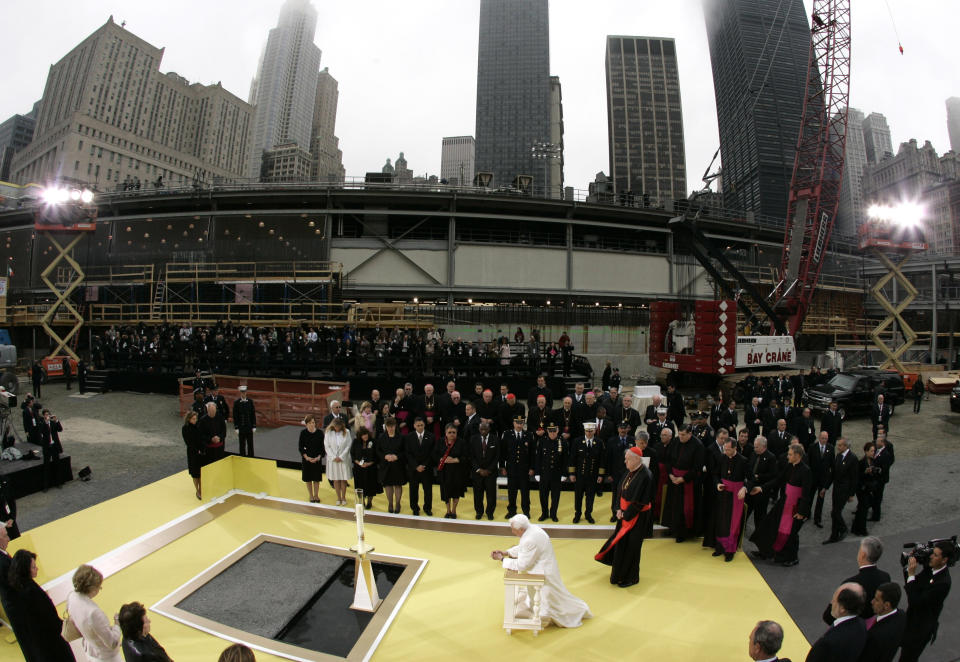 FILE - Pope Benedict XVI, center, kneels in prayer during his visit to ground zero in New York on April 20, 2008. Pope Emeritus Benedict XVI, the German theologian who will be remembered as the first pope in 600 years to resign, has died, the Vatican announced Saturday. He was 95. (AP Photo/Pier Paolo Cito, Pool, File)