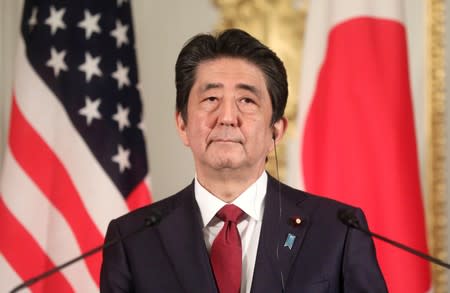 FILE PHOTO: Japanese Prime Minister Shinzo Abe holds a joint news conference with visiting U.S. President Donald Trump (not pictured) in Tokyo
