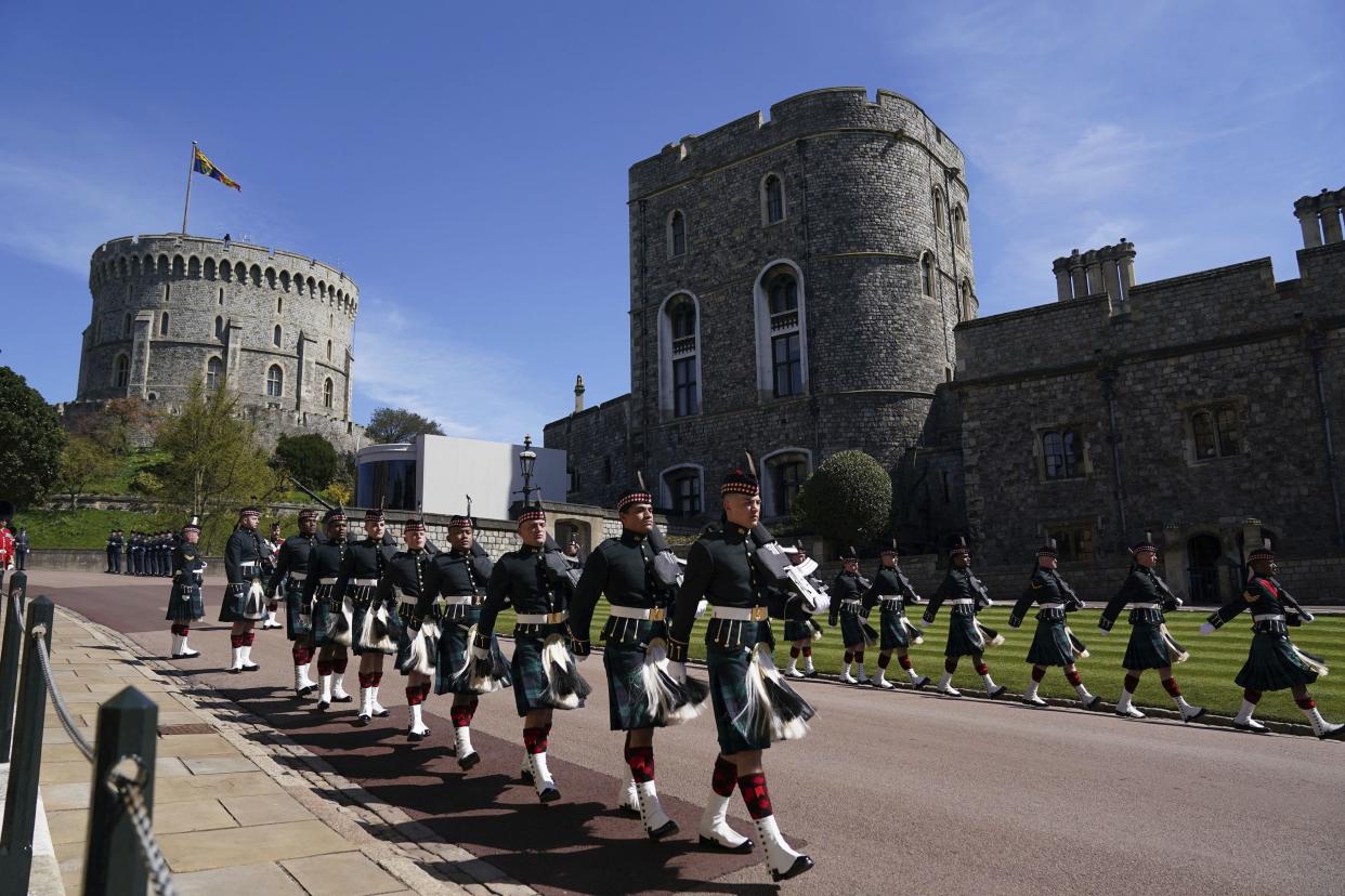 Members of the military march outside Windsor Castle, in Windsor, England, Saturday April 17, 2021, during the funeral of Britain's Prince Philip.