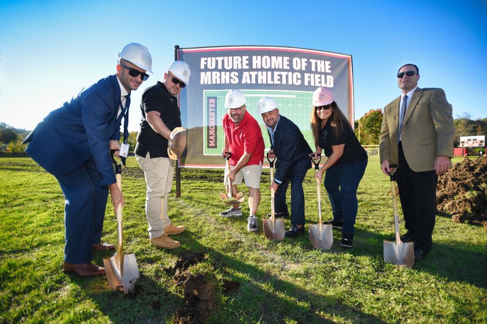 (L to R), Gary Lubisco, Jr., Superintendent, Valdo Panzera, Board President, Hillton Gonzalez, Vice President, Patrick DeMarco, Trustee, Liliana Baez, Trustee and Ralph Barca, Board member, pose with shovels for the groundbreaking ceremony for an artificial turf field and stadium-style lights, a $1.85 million project, at Giacin field of  Manchester Regional High School in Haledon on 11/01/21.