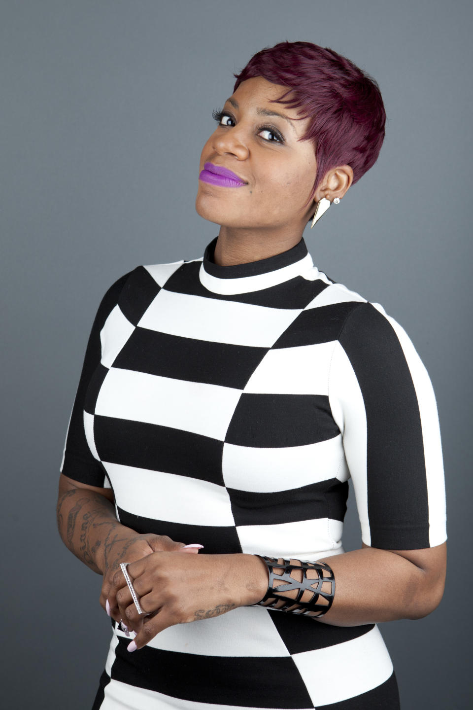 This April 24, 2013 photo shows American R&B singer Fantasia Barrino posing for a portrait in New York. Barrino will star in the Broadway-bound “After Midnight," a musical revue celebrating Duke Ellington's years at the famous Cotton Club nightclub in Harlem. Producers said Thursday, July 18, that Barrino, last seen on Broadway in “The Color Purple,” will be their first guest star in the show. Performances start on Oct. 18, with an official opening night set for Nov. 3. Barrino ends her run Feb. 9. (Photo by Amy Sussman/Invision/AP, File)