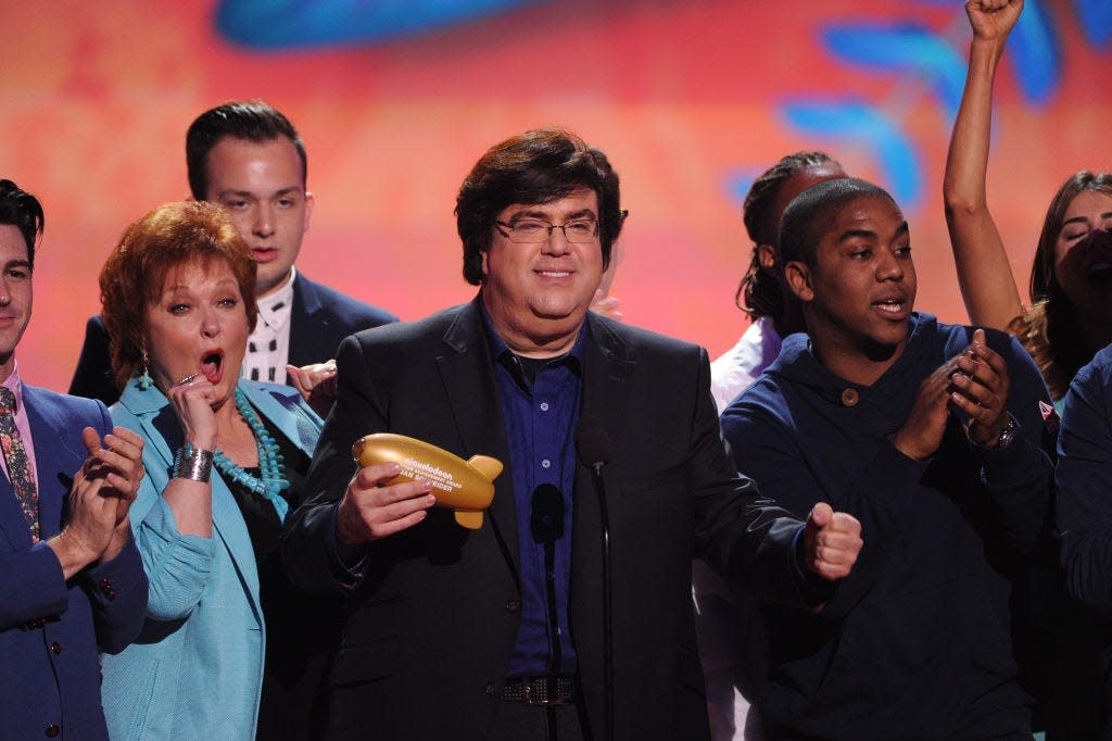 Dan Schneider accepts the Lifetime Achievement Award onstage with actors Maree Cheatham and Christopher Massey during Nickelodeon's 27th Annual Kids' Choice Awards on March 29, 2014.