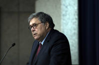 U.S. Attorney General William Barr speaks at the Gerald R. Ford Presidential Museum in Grand Rapids, Mich., Thursday, July 16, 2020. The United States has become overly reliant on Chinese goods and services, including face masks, medical gowns and other protective equipment designed to curb the spread of the coronavirus, Attorney General Barr said Thursday. (Nicole Hester/Mlive.com/Ann Arbor News via AP)