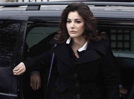 TV chef Nigella Lawson arrives at Isleworth Crown Court in west London December 4, 2013. REUTERS/Luke Macgregor