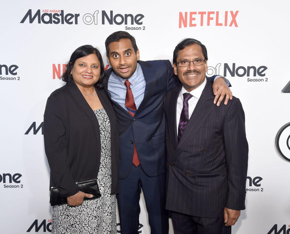 Ansari and his parents at a media event