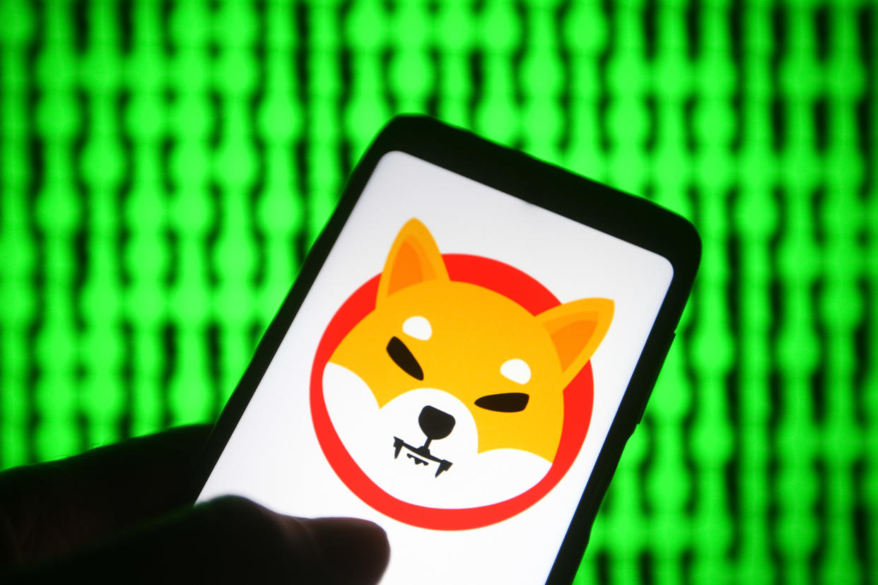 UKRAINE - 2021/06/03: In this photo illustration, a cryptocurrency Shiba Token $SHIB (Shiba Inu) logo is seen on a smartphone with a pc screen in the background. (Photo Illustration by Pavlo Gonchar/SOPA Images/LightRocket via Getty Images)