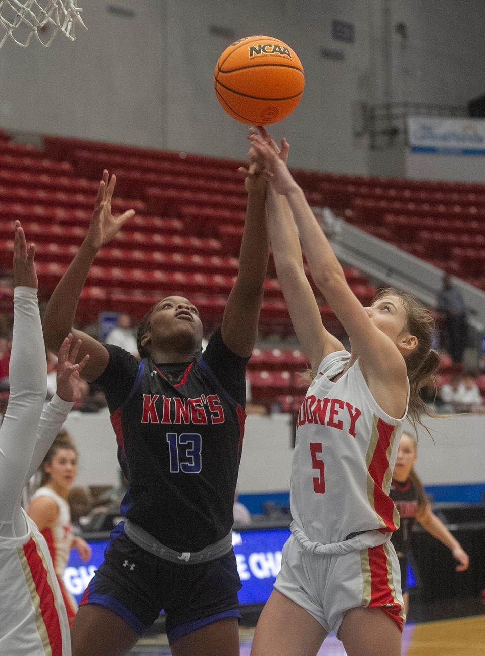 KingÕs Academy's Jade Jones (13) battles for a rebound with Cardinal Mooney High School's Josie Maloni (5) during their FHSAA Girls 3A girls semifinal basketball game at The RP Funding Center in Lakeland Wednesday. February 22, 2023. (SPECIAL TO THE PALM BEACH POST/MICHAEL WILSON)