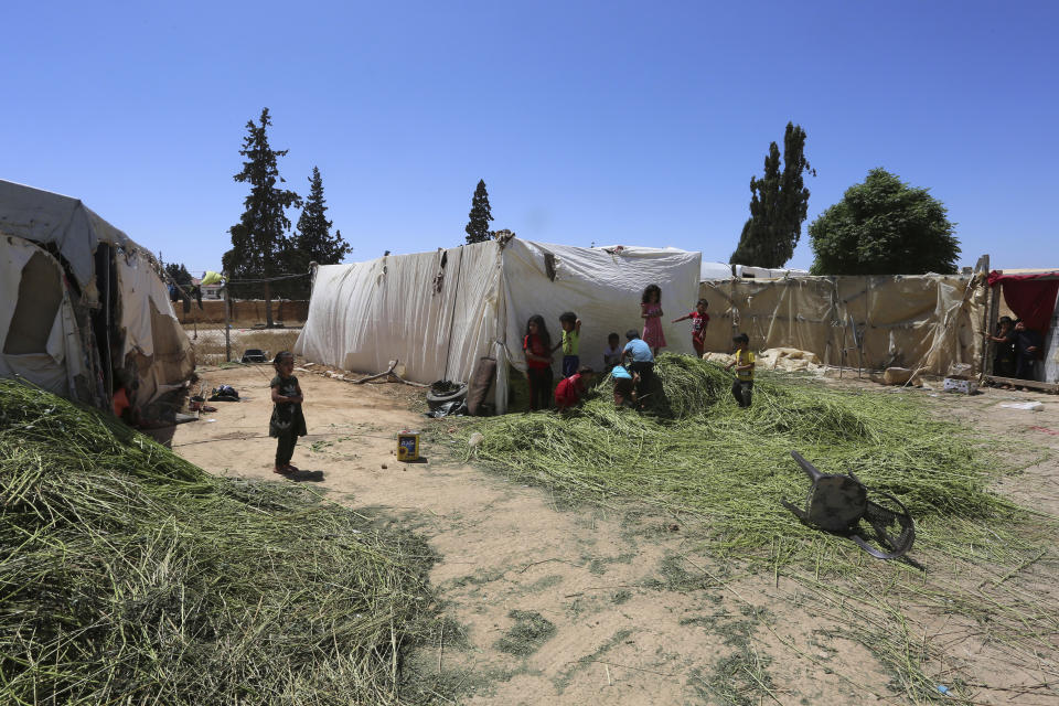 Syrian children play in a refugee camp near Amman, Jordan, on Monday, June 5, 2023. (AP Photo/Raad Adayleh)