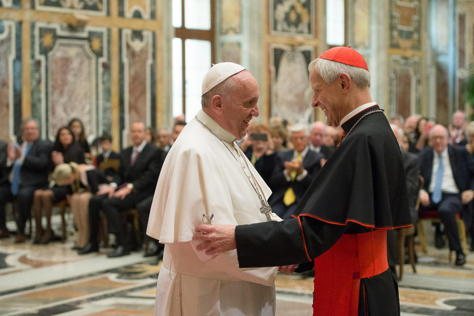 CORRECTS THE CREATION DATE TO APRIL 17, 2015, NOT OCT. 20, 2010 - FILE - In this April 17, 2015, file photo, Pope Francis, left, talks with Papal Foundation Chairman Cardinal Donald Wuerl, Archbishop of Washington, D.C., during a meeting with members of the Papal Foundation at the Vatican. On Tuesday, Aug. 14, 2018, a Pennsylvania grand jury accused Cardinal Wuerl of helping to protect abusive priests when he was Pittsburgh's bishop. (L'Osservatore Romano/Pool Photo via AP)