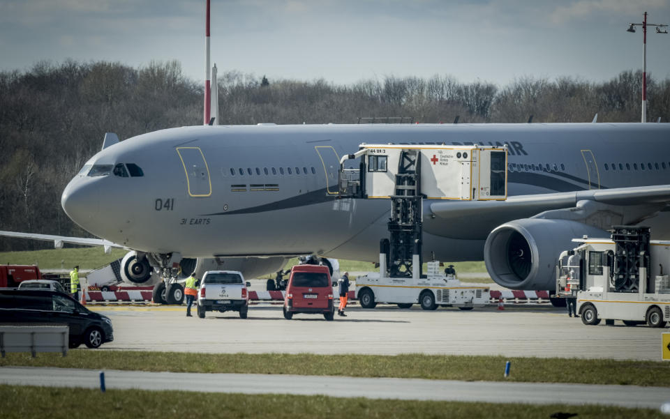 An Airbus A330 of the French Air Force is on display at the Airport of Hamburg, Germany, Tuesday, March 31, 2020. The plane will fly six corona patients who need to be ventilated to Germany for treatment. In order to slow down the spread of the coronavirus, the German government has considerably restricted public life and asked the citizens to stay at home. The new coronavirus causes mild or moderate symptoms for most people, but for some, especially older adults and people with existing health problems, it can cause more severe illness or death. (Axel Heimken/dpa via AP)