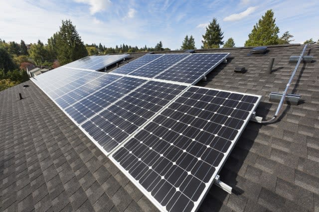 Solar panels fixed on the rooftop of a house