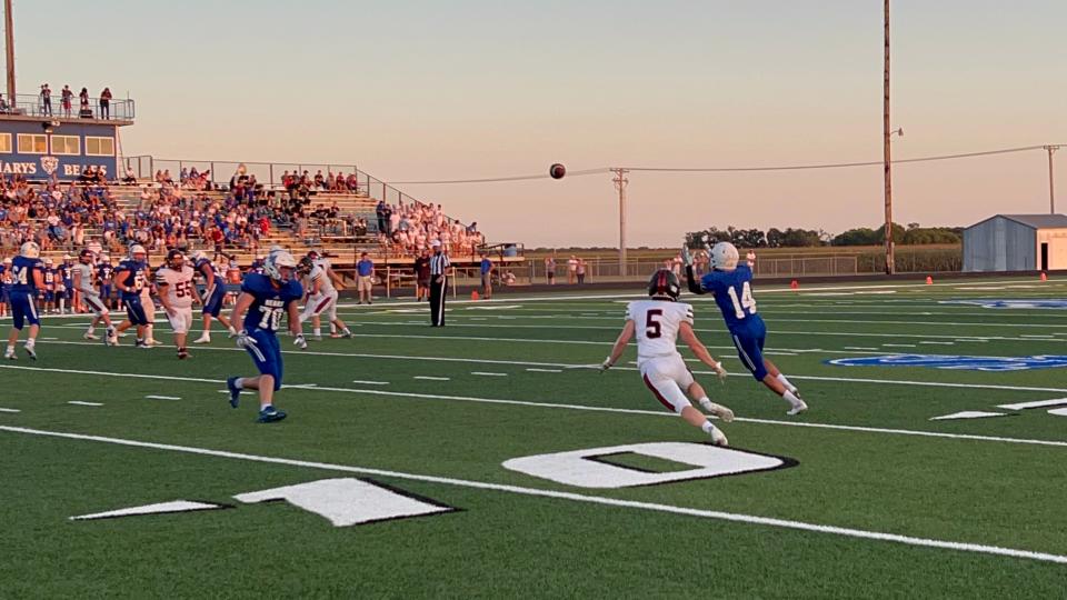St. Marys junior Michael Gallegos catches a bubble screen pass and would take it in for one of three St. Marys touchdowns through the air.