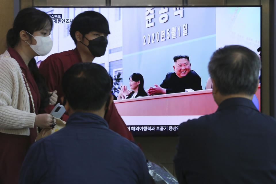 People watch a TV showing an image of North Korean leader Kim Jong Un and his sister Kim Yo Jong during a news program at the Seoul Railway Station in Seoul, South Korea, Saturday, May 2, 2020. Kim made his first public appearance in 20 days as he celebrated the completion of a fertilizer factory near Pyongyang, state media said Saturday, ending an absence that had triggered global rumors that he was seriously ill. (AP Photo/Ahn Young-joon)