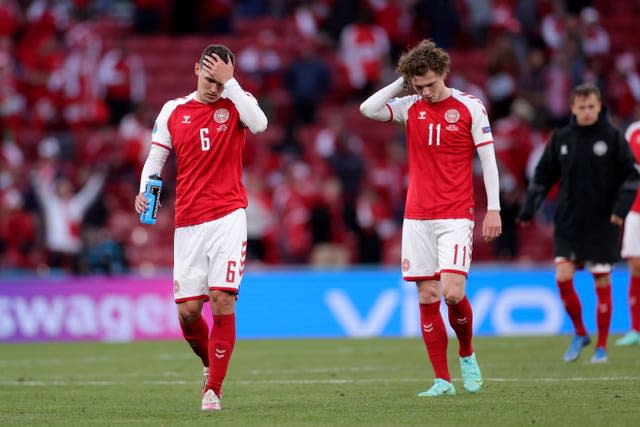 Denmark’s Andreas Christensen (left), and Andreas Skov Olsen leave the pitch