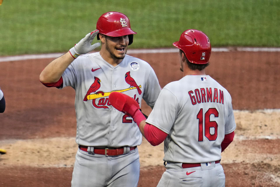 St. Louis Cardinals' Nolan Arenado, left, celebrates with Nolan Gorman as he returns to the dugout after hitting a two-run home run off Pittsburgh Pirates starting pitcher Roansy Contreras during the third inning of a baseball game in Pittsburgh, Friday, June 2, 2023. (AP Photo/Gene J. Puskar)