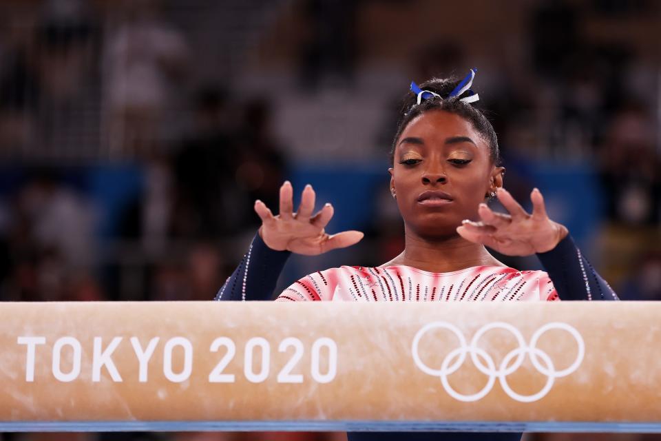 Simone Biles prepares to compete in the Women's Balance Beam Final on day eleven of the Tokyo 2020 Olympic Games.