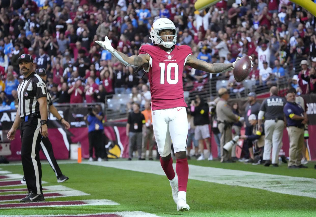 Nov 27, 2022; Glendale, AZ, USA;  Arizona Cardinals wide receiver DeAndre Hopkins (10) celebrates after a touchdown catch against the Los Angeles Chargers during the first quarter at State Farm Stadium.