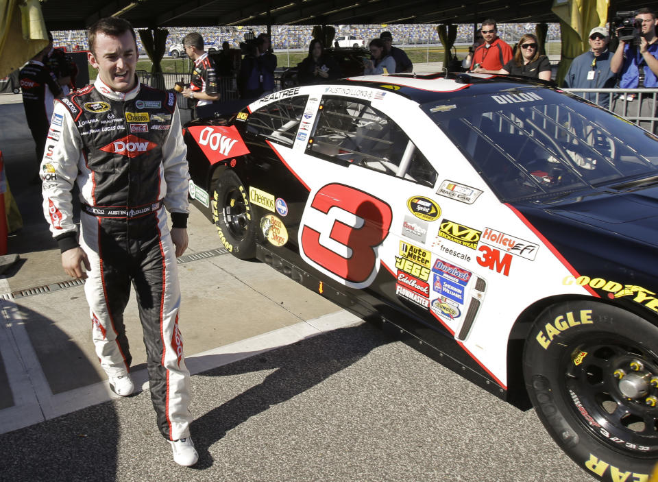 CORRECTS NAME TO DILLON NOT DILLION Austin Dillon walks by his car in the garage area after he won the pole position during qualifying for the Daytona 500 NASCAR Sprint Cup Series auto race at Daytona International Speedway in Daytona Beach, Fla., Sunday, Feb. 16, 2014. (AP Photo/John Raoux)