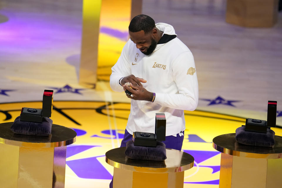 Los Angeles Lakers forward LeBron James receives his NBA championship ring