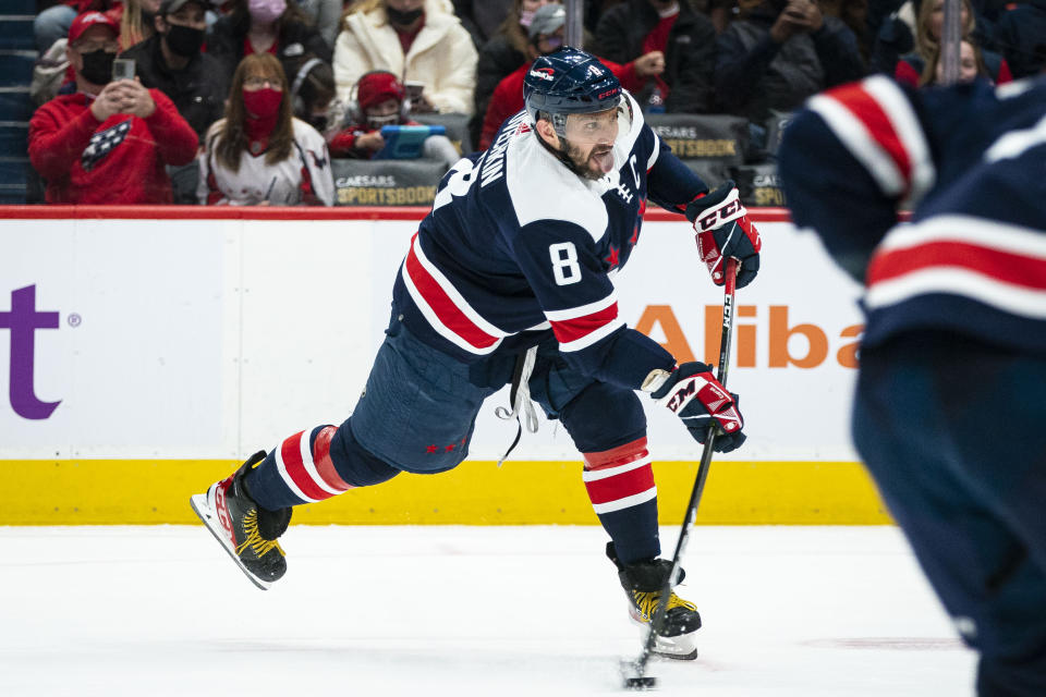 Washington Capitals left wing Alex Ovechkin (8), of Russia, shoots the puck during the second period of an NHL hockey game against the Vancouver Canucks, Sunday, Jan. 16, 2022, in Washington. (AP Photo/Al Drago)