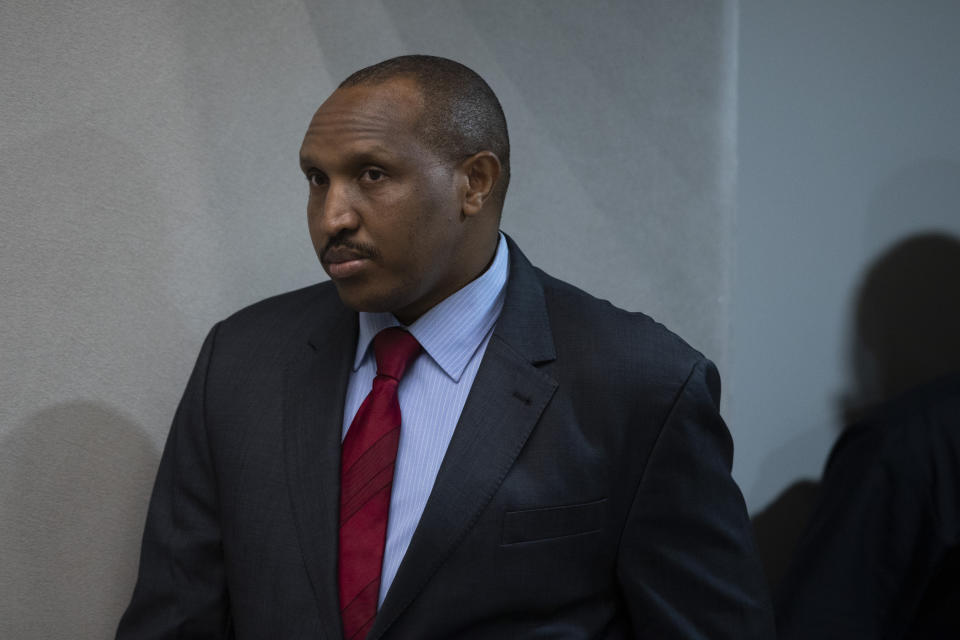 Congolese militia commander Bosco Ntaganda enters the courtroom of the International Criminal Court, or ICC, to hear the sentence in his trial in The Hague, Netherlands, Thursday, Nov. 7, 2019. The ICC delivered the sentence on Ntaganda, accused of overseeing the slaughter of civilians by his soldiers in the Democratic Republic of Congo in 2002 and 2003. (AP Photo/Peter Dejong, Pool)