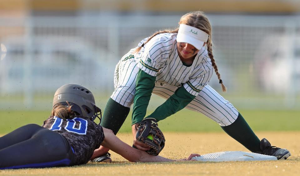 STVM second baseman Kennedy Brophy, top, tags out Coventry baserunner Rylee Hillyard during the sixth inning of a Division II district final softball game at Willig Park, Thursday, May 18, 2023, in Canton, Ohio.