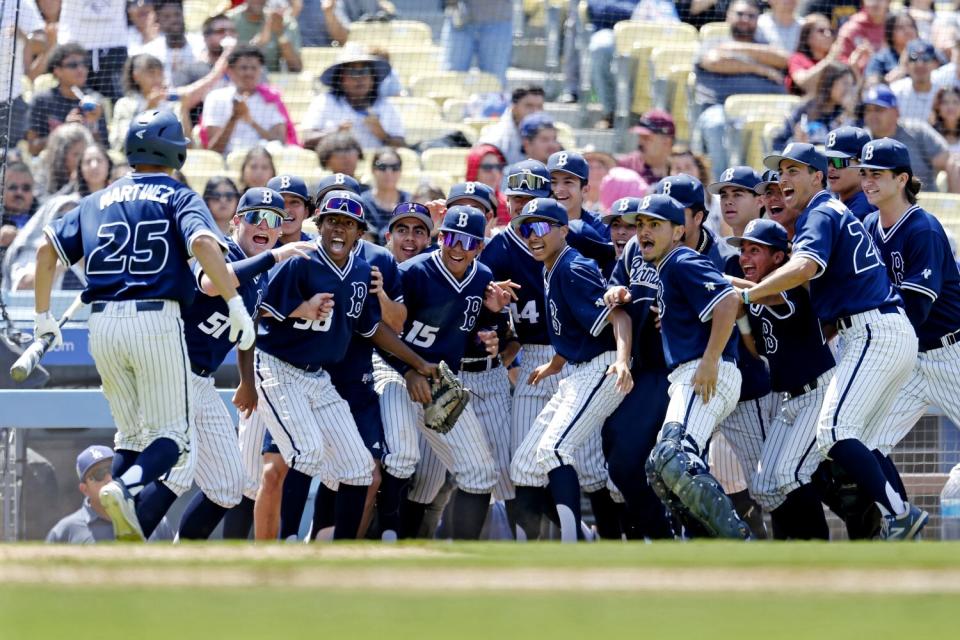 Birmingham Charter baseball players cheer a teammate.